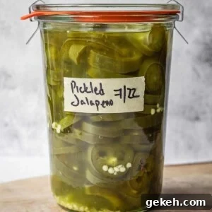 Mason jar full of quick pickled jalapenos.