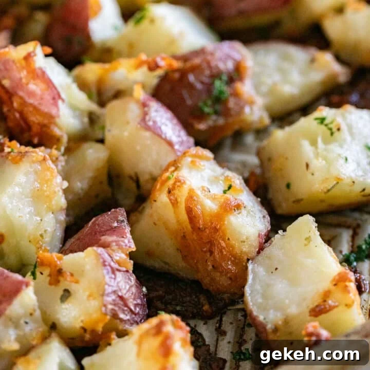 A close up image of roasted potatoes on a sheet pan.