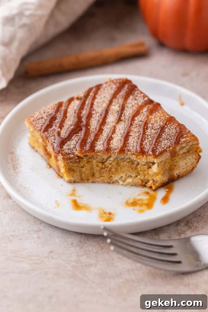 Churro Pumpkin Cheesecake Bars Recipe — Step-by-Step Guide 10 Churro Pumpkin cheesecake bars on a plate with a bite taken out