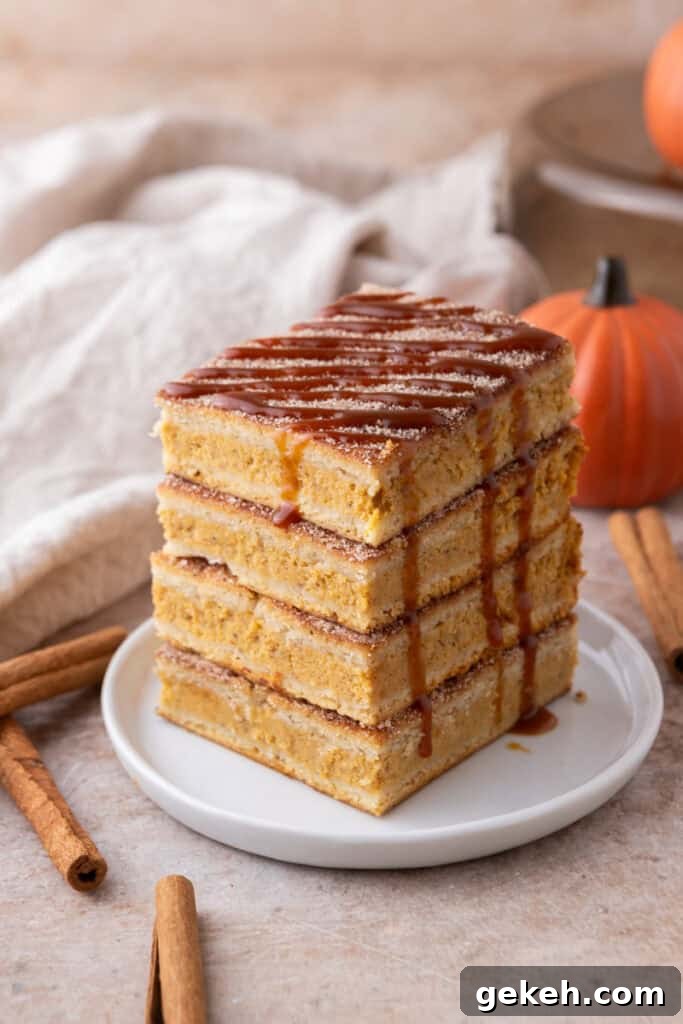 Churro Pumpkin Cheesecake Bars Recipe — Step-by-Step Guide 4 Churro pumpkin cheesecake bars stacked on a plate