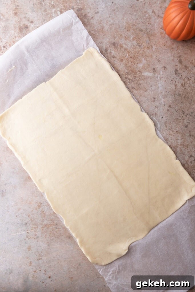 Churro Pumpkin Cheesecake Bars Recipe — Step-by-Step Guide 7 can of dough rolled out