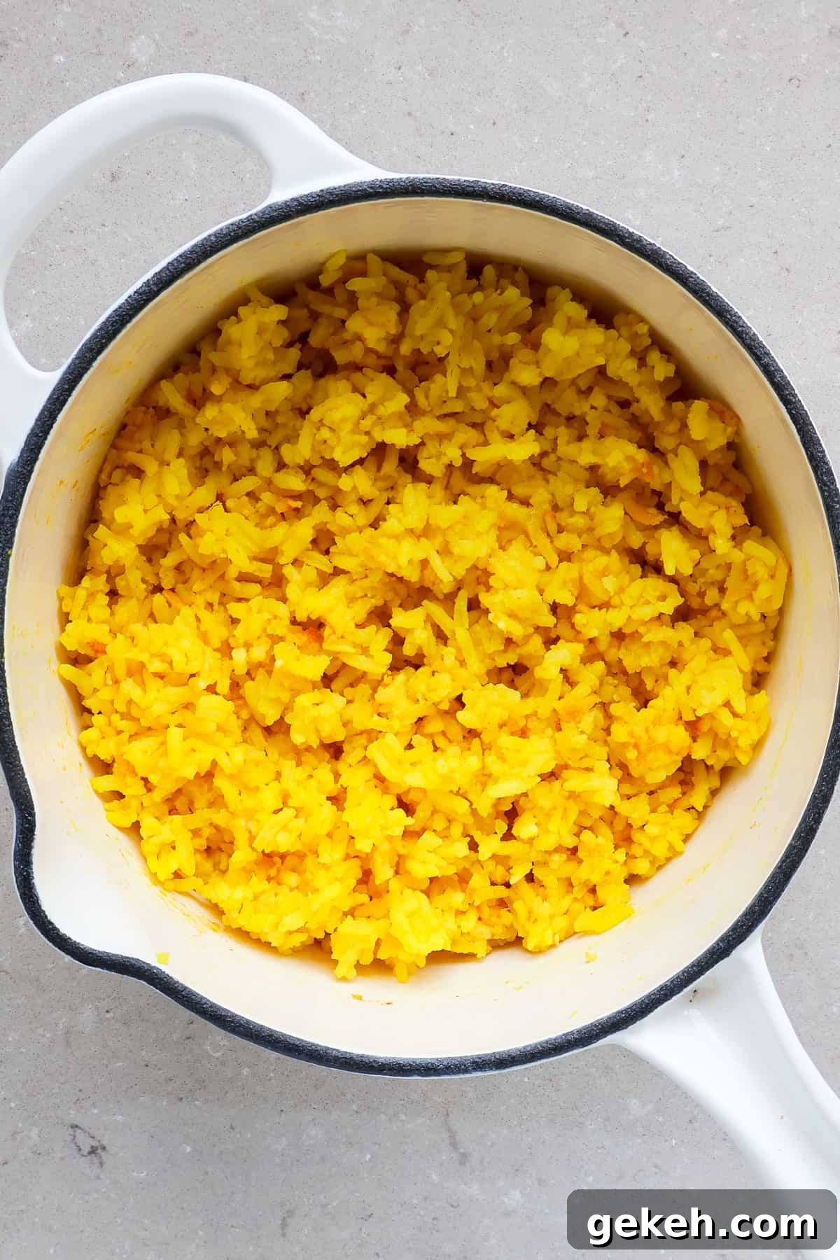 Chicken Shawarma Bowls with Garlic Sauce and Rice 7 Golden turmeric rice in a pot.