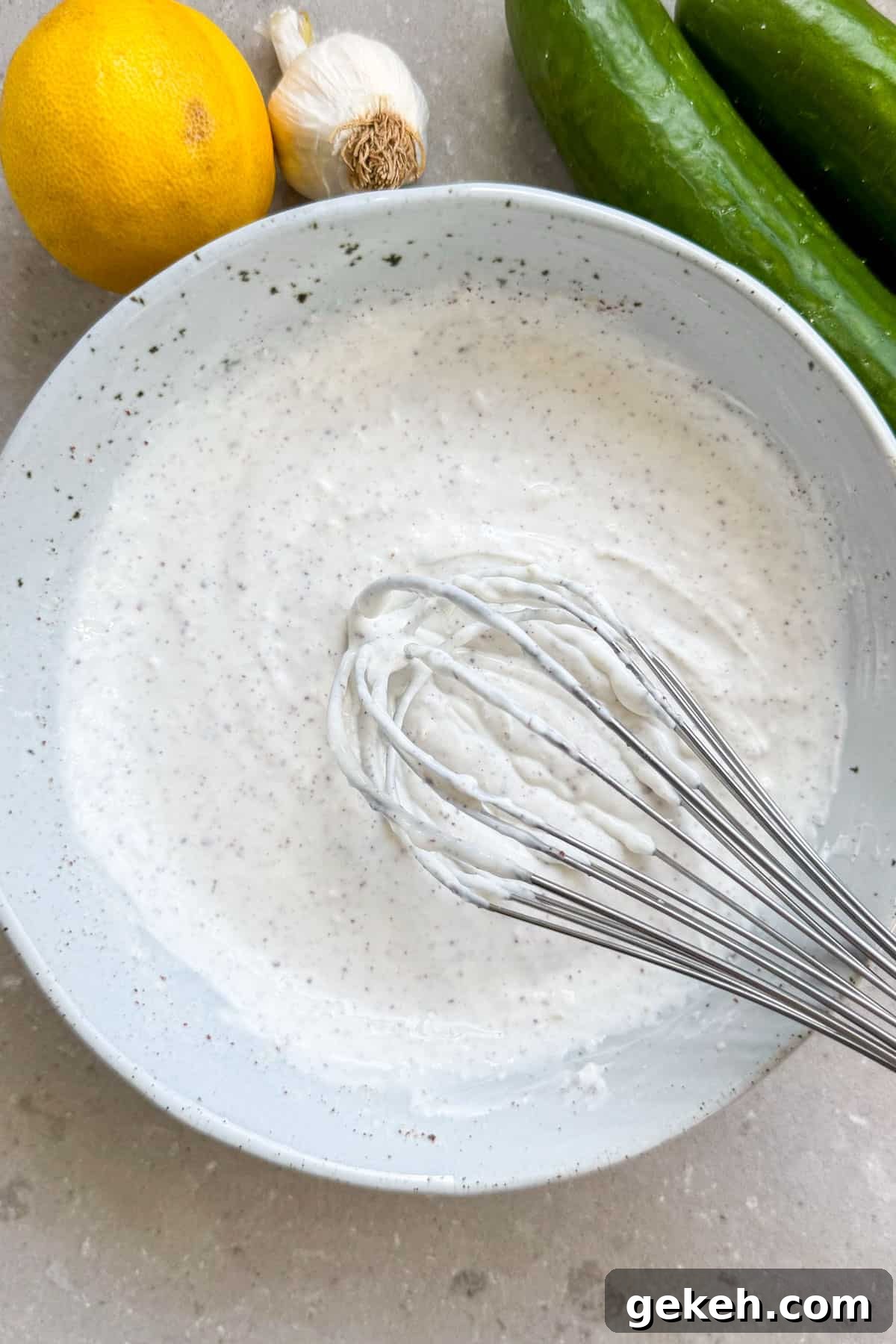 Chicken Shawarma Bowls with Garlic Sauce and Rice 8 Sumac yoghurt sauce in a bowl.