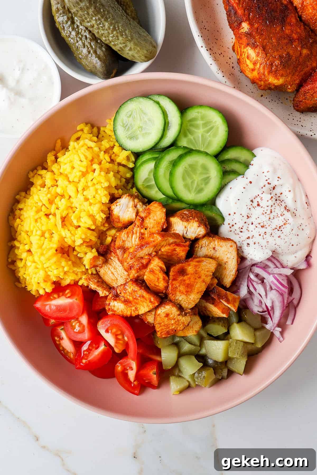 Chicken Shawarma Bowls with Garlic Sauce and Rice 10 Chicken shawarma rice bowls with cucumbers, tomatoes, pickles, onions and yogurt sauce.