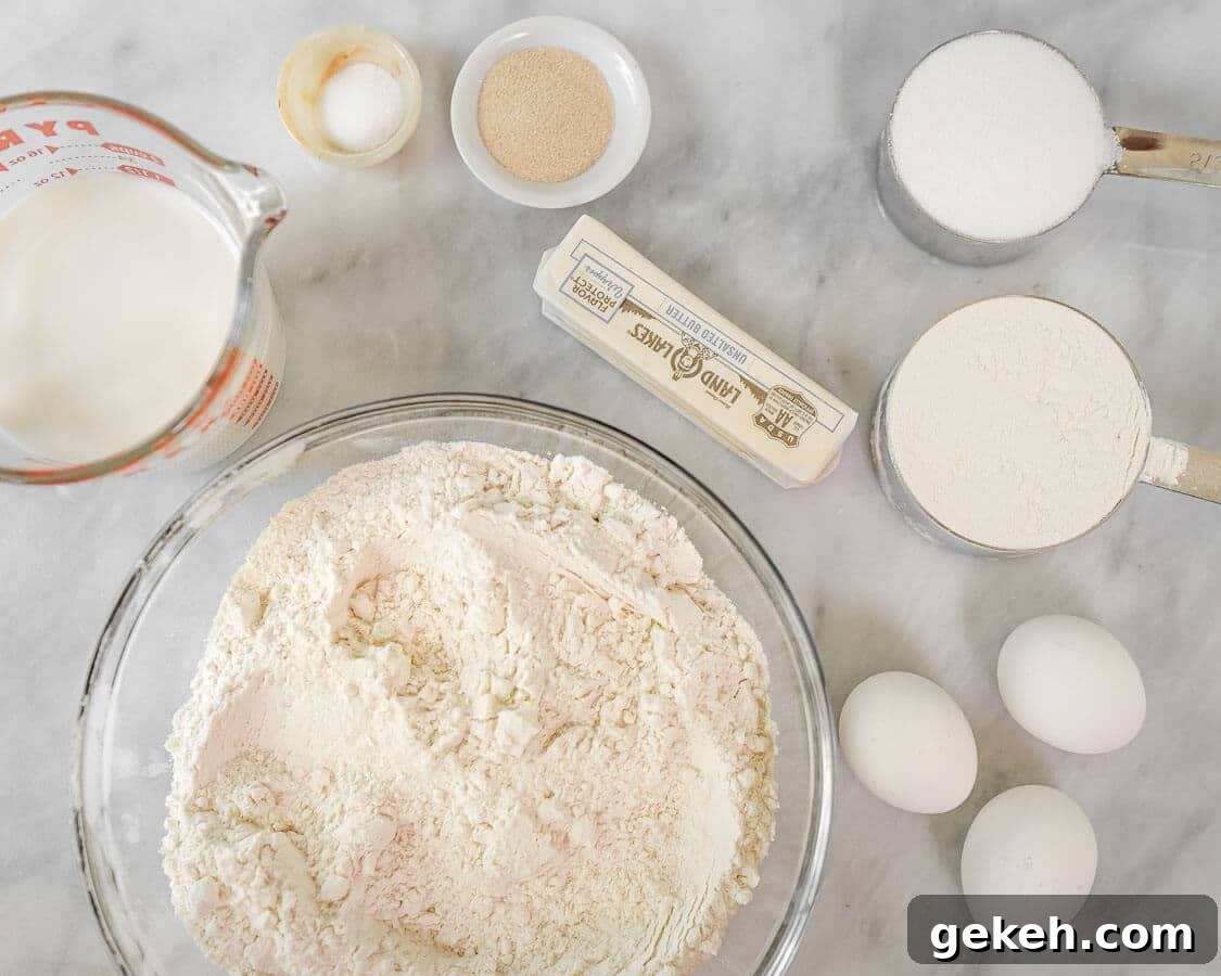 Authentic Kifli (Hungarian Walnut Roll) Recipe for Homemade Pastry 3 Ingredients used to make Kifli Walnut Rolls including flour, yeast, eggs, sugar, butter, salt, and milk in a large bowl.