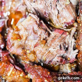 Smoked Chuck Roast Recipe: Tender, Juicy BBQ Roast 7 Close-up of juicy, tender smoked brisket with visible seasoning and a slightly charred crust, reminiscent of a perfectly prepared smoked chuck roast.