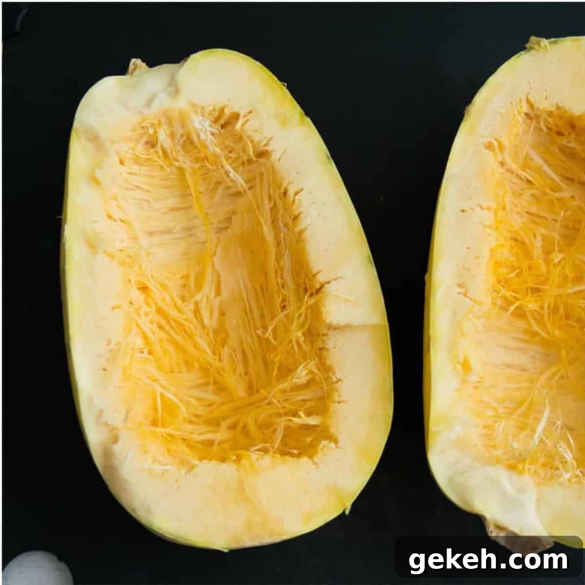 A spaghetti squash that has been cut in half.
