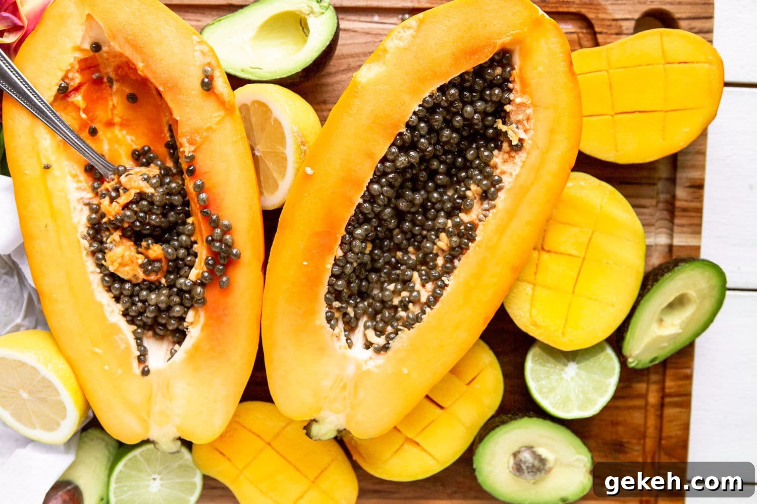 Ethiopian Spices: Authentic Flavors and Cooking Tips 4 a papaya cut in half with avocados and mangoes on the side.
