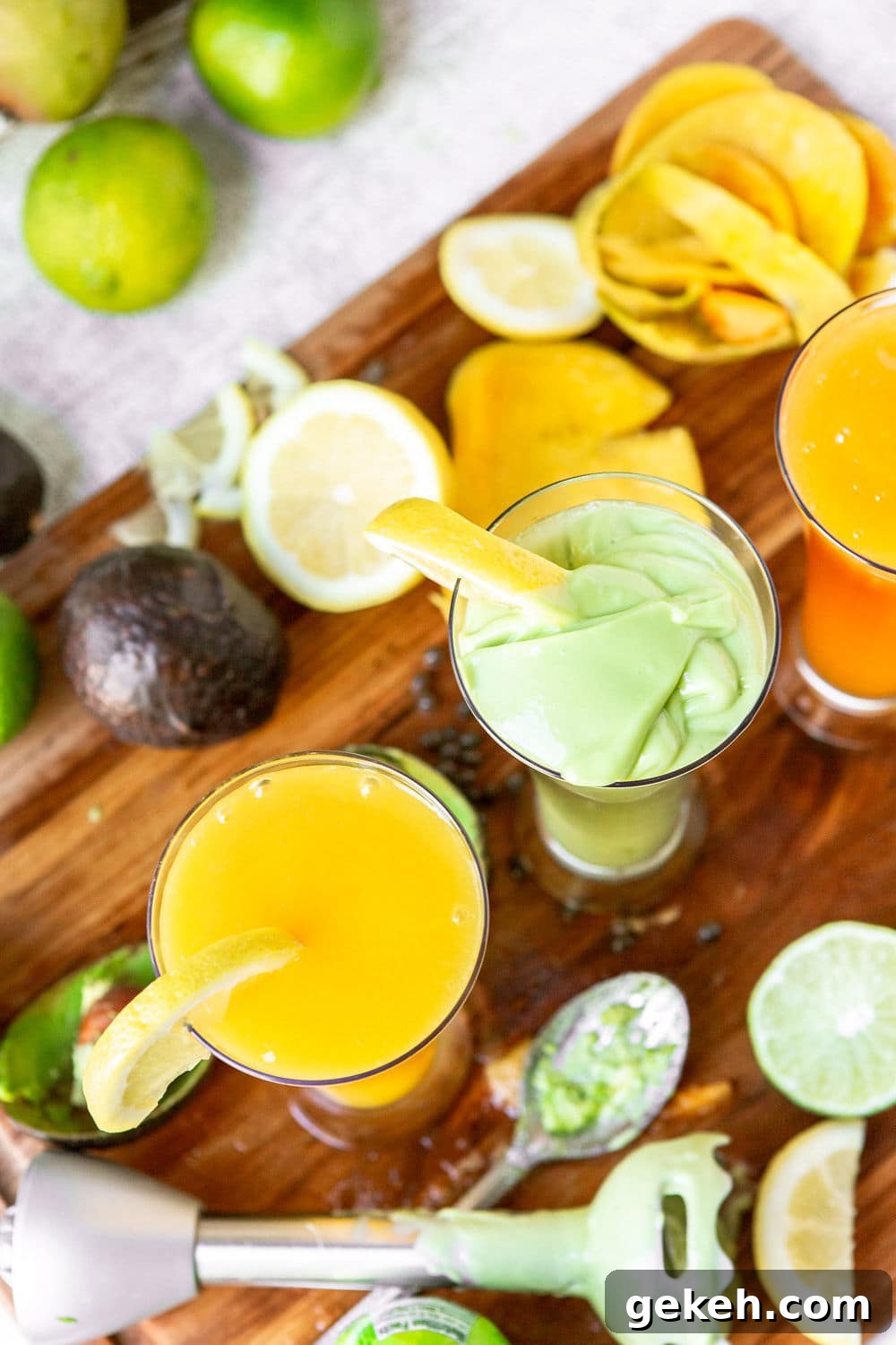 Ethiopian Spices: Authentic Flavors and Cooking Tips 5 two glasses filled with a green and yellow juice with an immersion blender on the side.