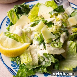 Classic caesar salad on a plate for serving.