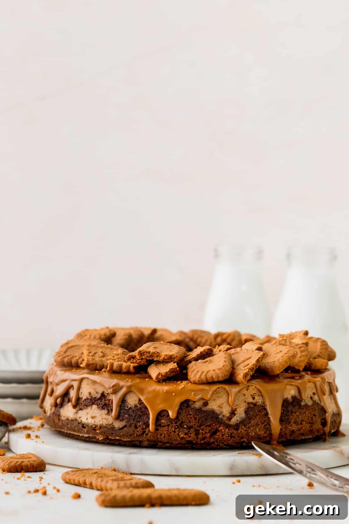 Biscoff cheesecake on top of a marble board.