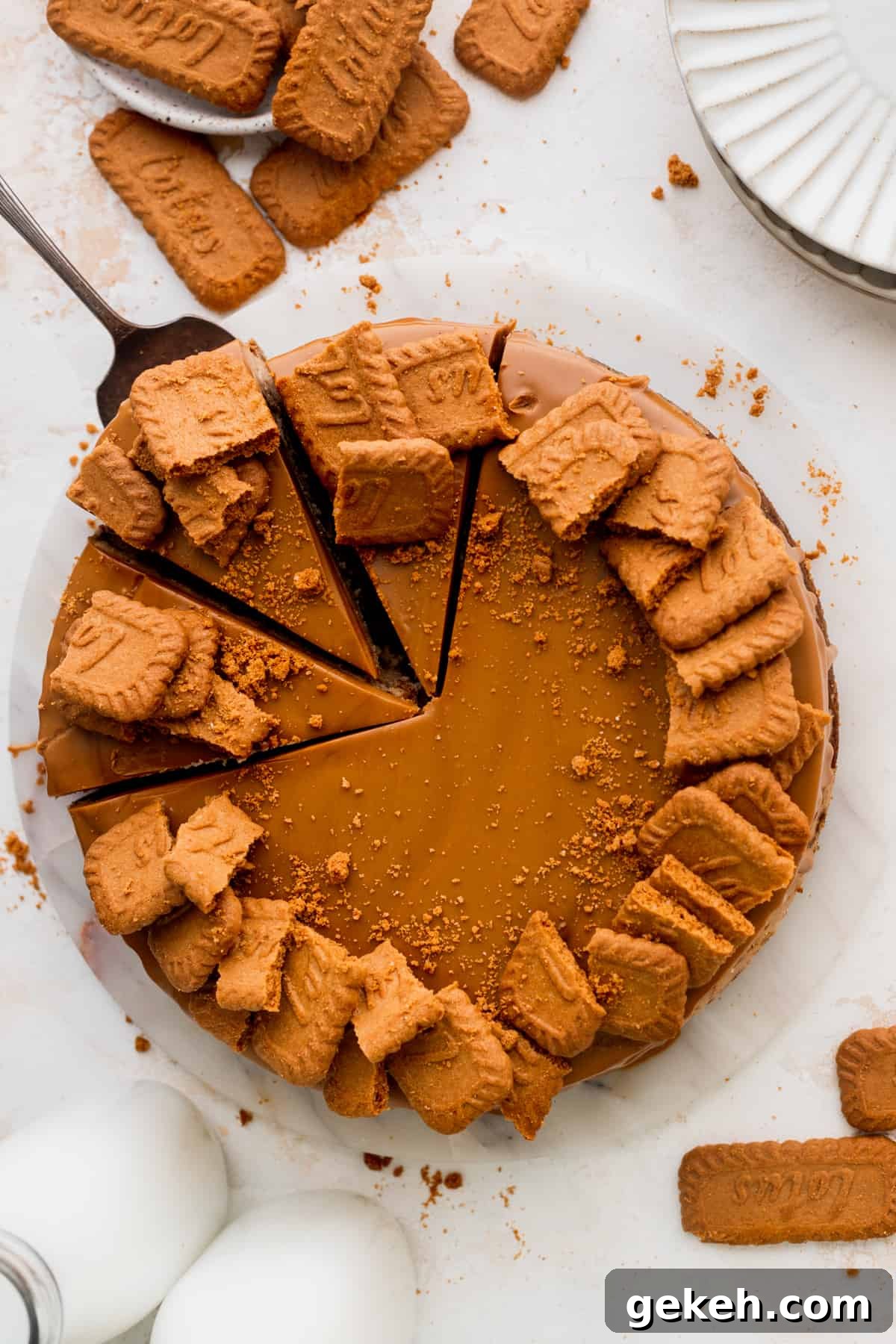 Taking a slice out of the biscoff cheesecake.