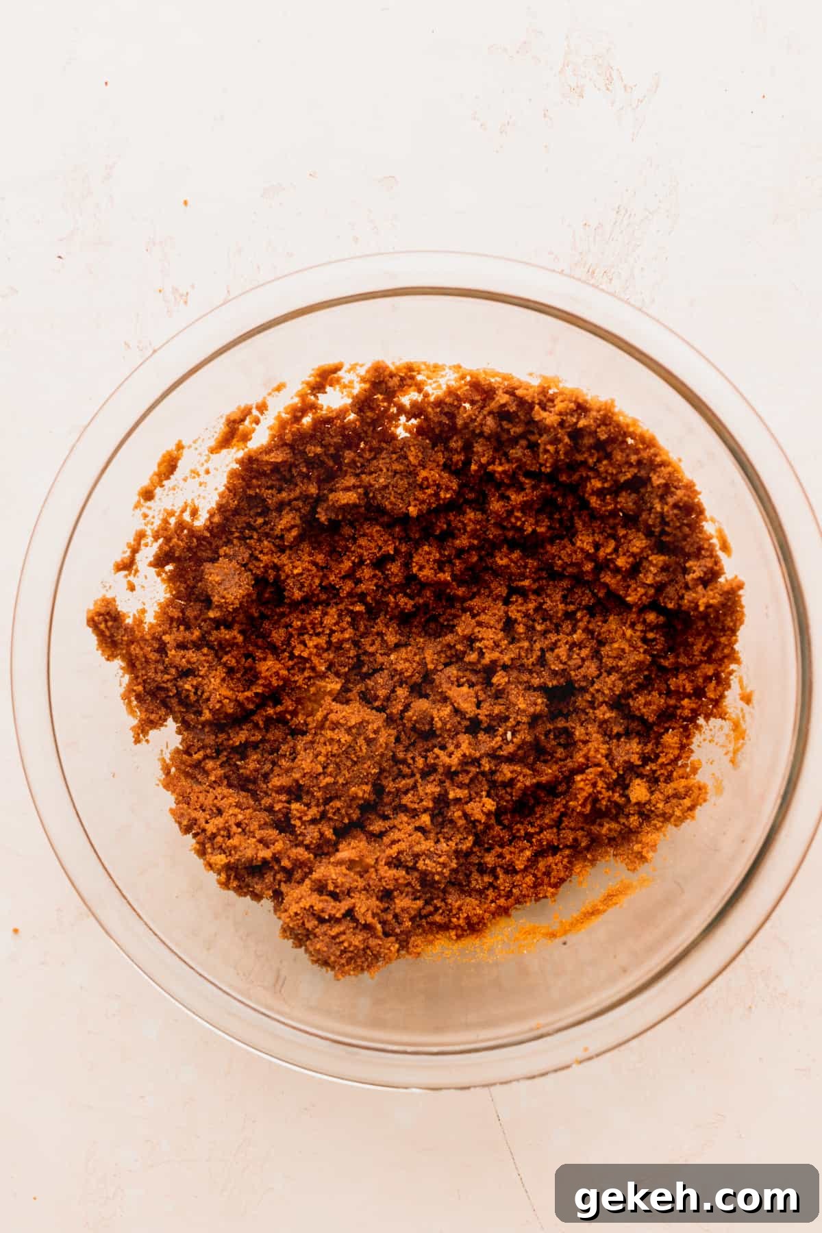 Biscoff cookie crumbs in a glass bowl.