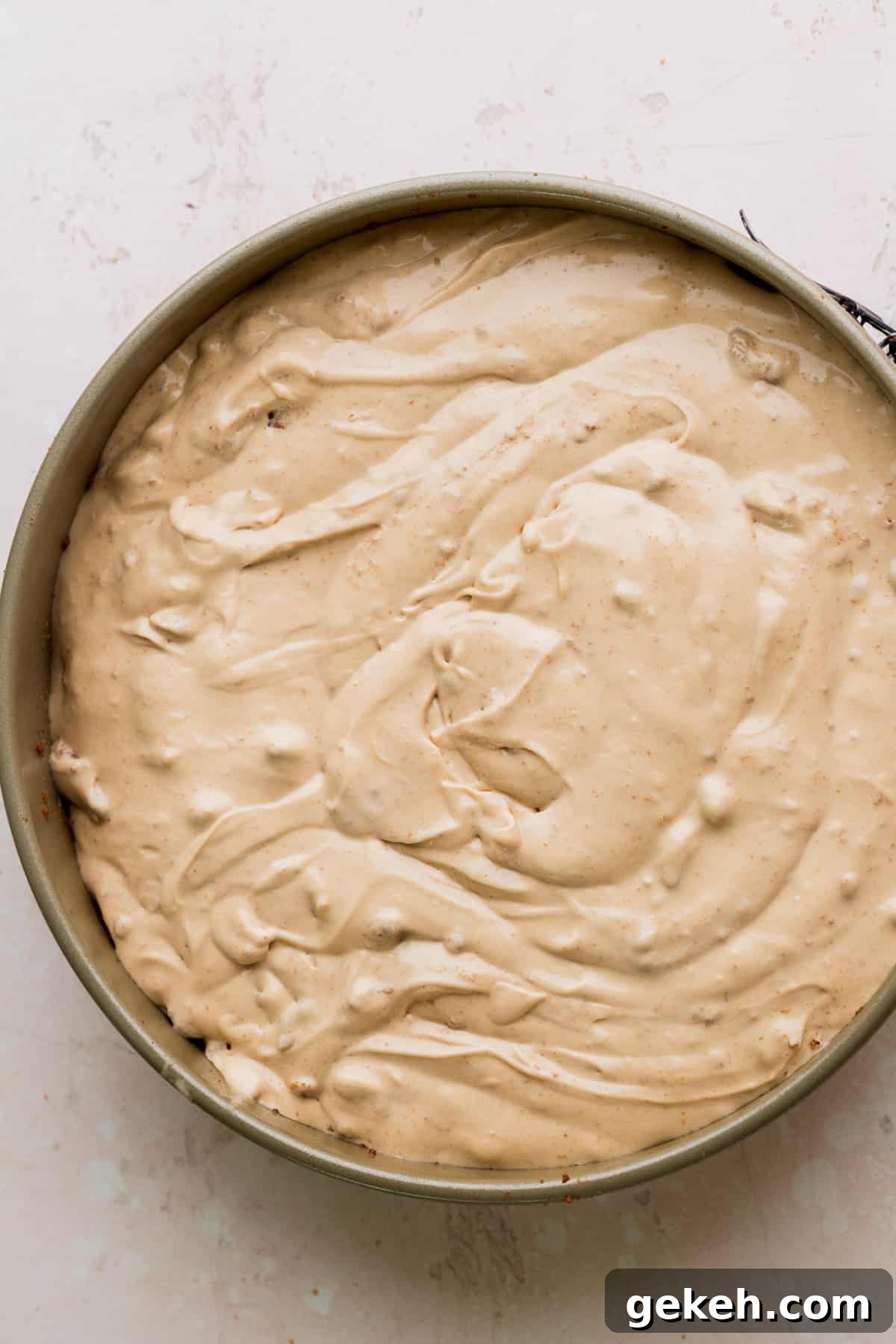 Cheesecake batter in a springform pan.