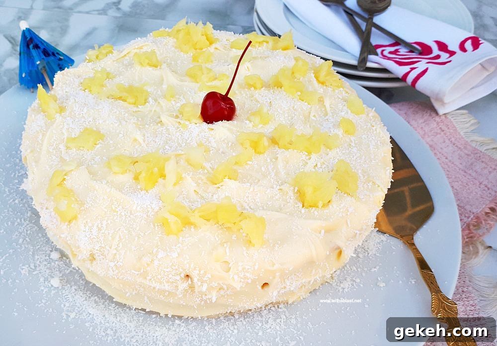 Pina Colada Cake is so soft and moist with an equally delicious frosting - filled with the flavors of the tropical cocktail which just screams Summer !