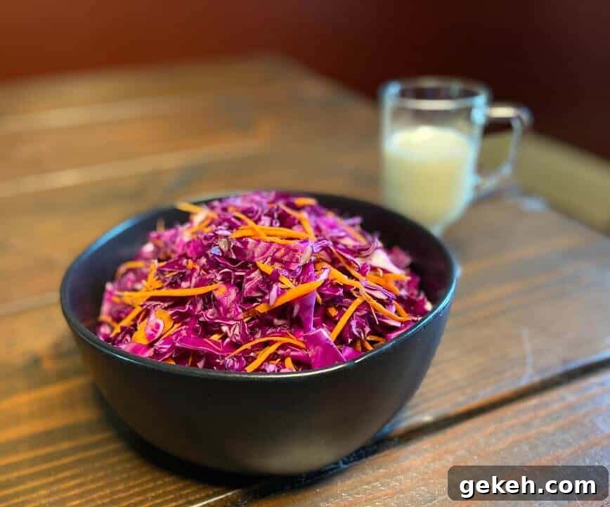 Classic Homemade Coleslaw Recipe with Creamy Tangy Dressing 6 Shredded cabbages and carrots in a bowl.