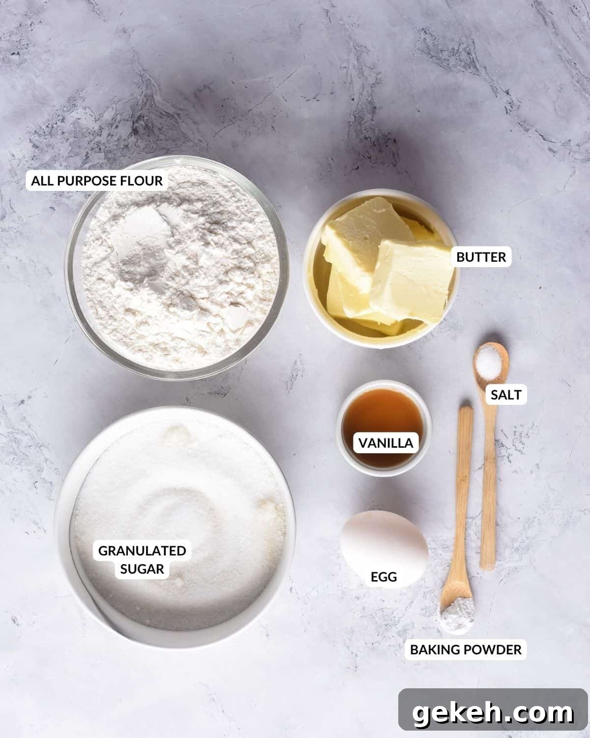 Overhead view of labeled ingredients for making base of sugar cookies