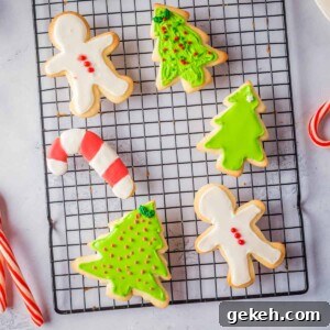 Close up overhead view of Christmas sugar cookies on a black wire rack.