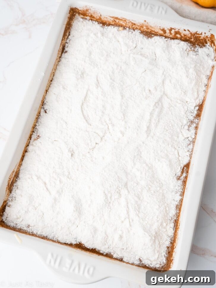 Pumpkin pie cake batter in a cake pan before baking.