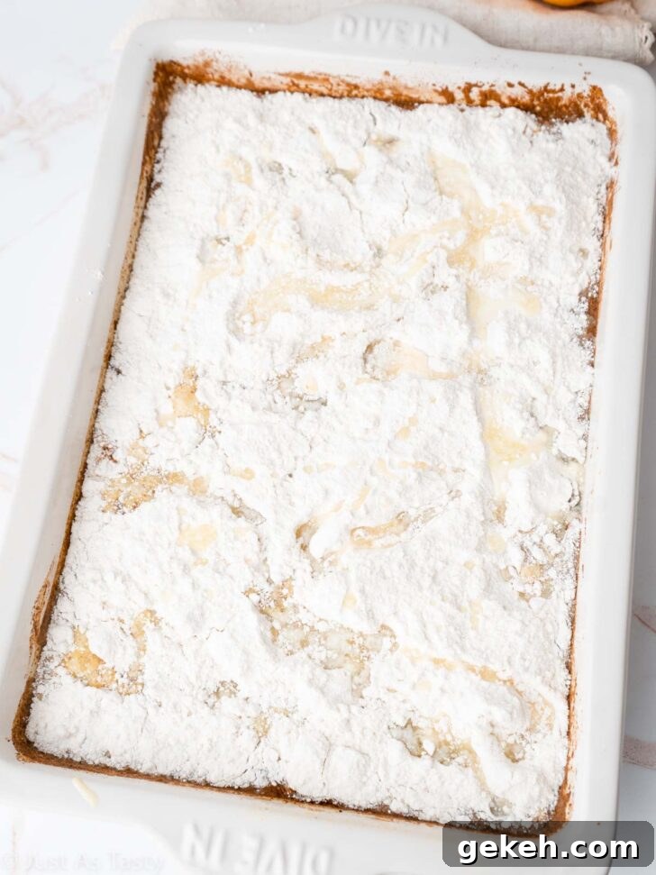 Pumpkin pie cake batter in a cake pan before baking.