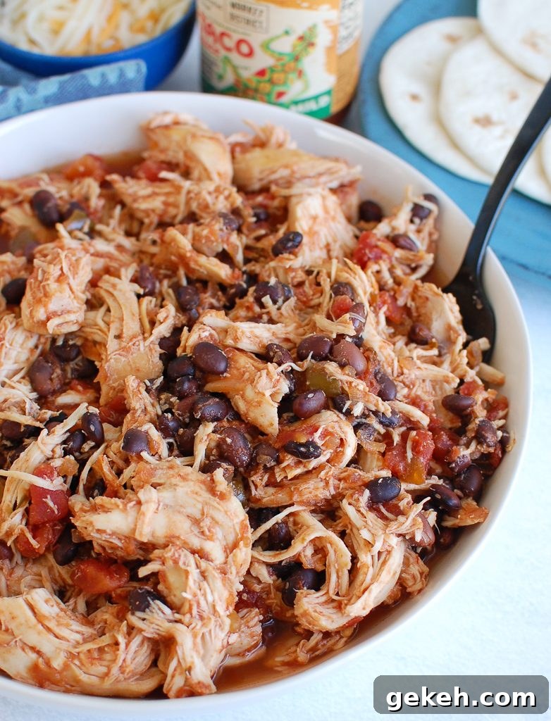 Tender Slow Cooker Shredded Chicken Recipe for Meal Prep 2 Slow Cooker Shredded Chicken in a white bowl