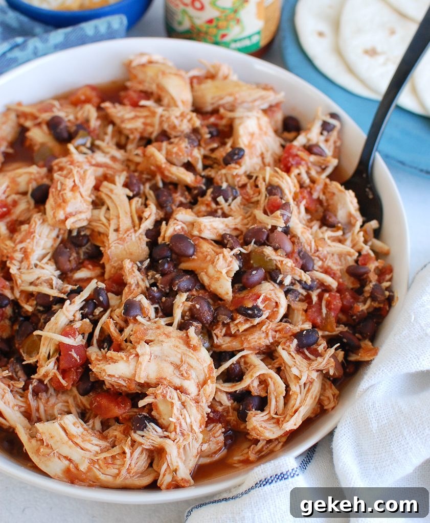 Tender Slow Cooker Shredded Chicken Recipe for Meal Prep 5 Slow Cooker Shredded Chicken with teal napkin
