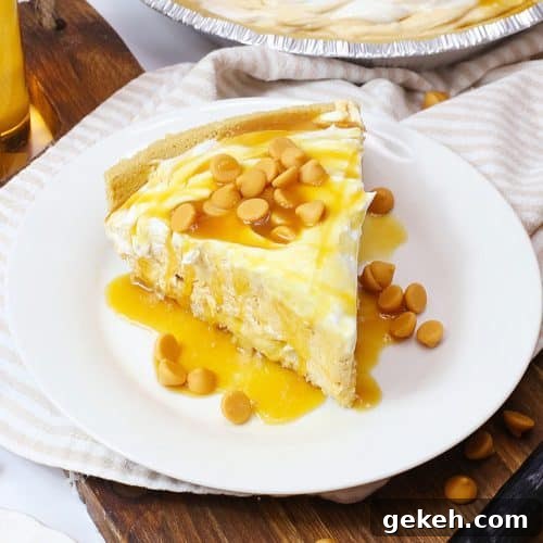 a slice of butterbeer pie topped with caramel sauce on a small white plate