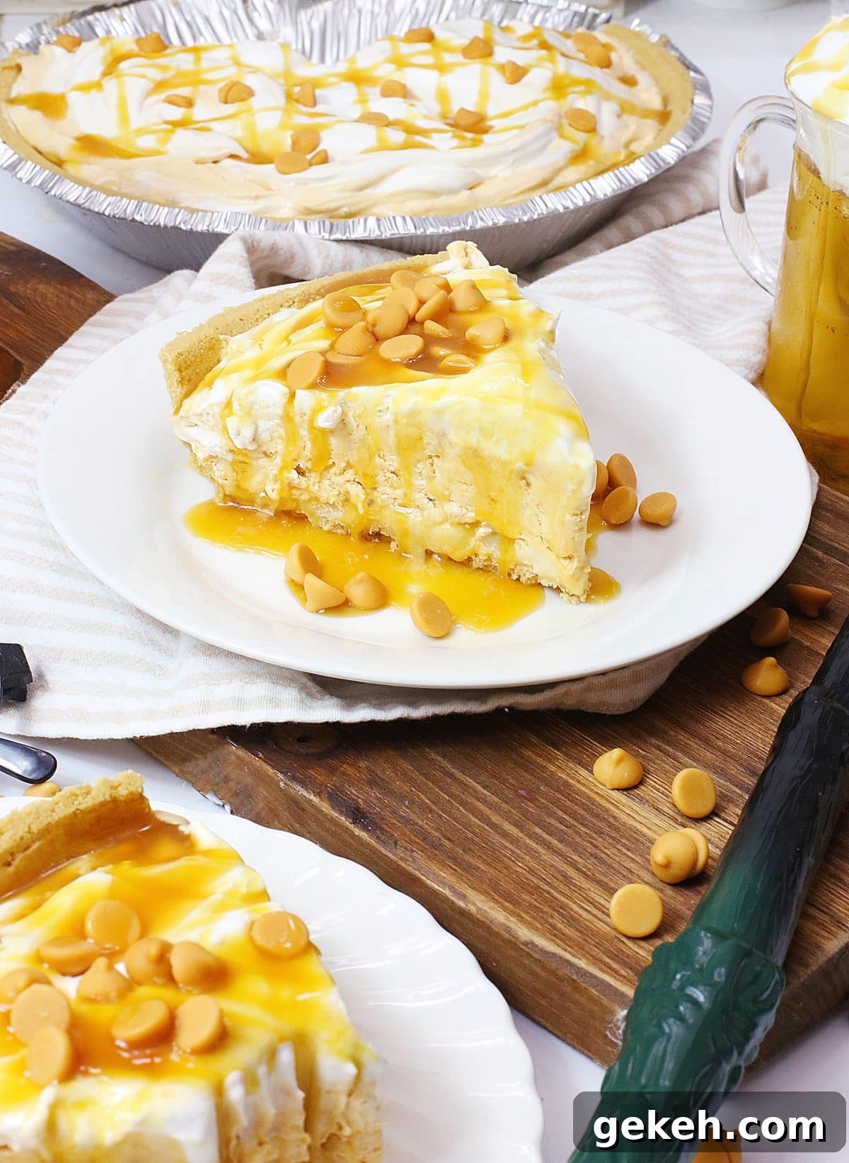 a slice of butterbeer pie topped with caramel sauce on a small white plate