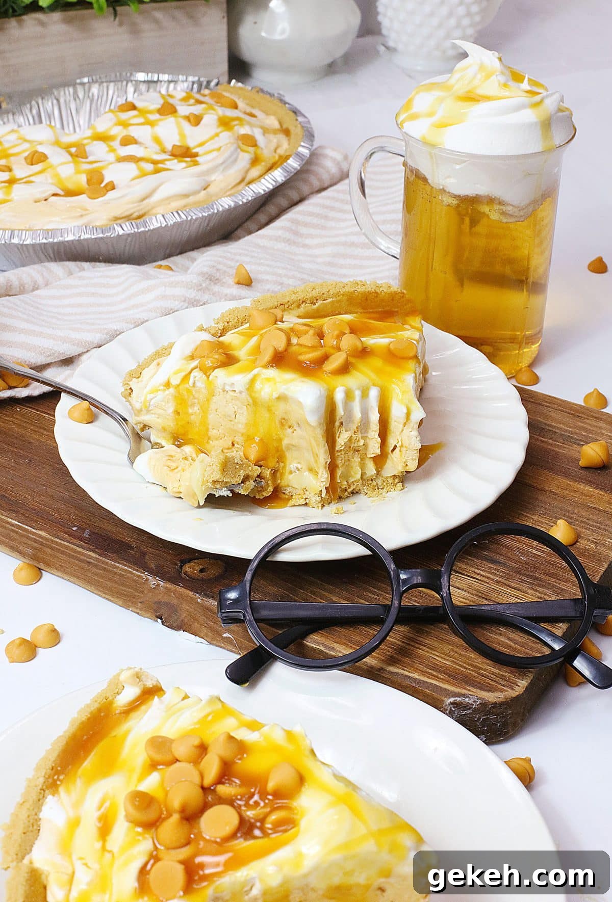 a slice of butterbeer pie topped with caramel sauce on a small white plate