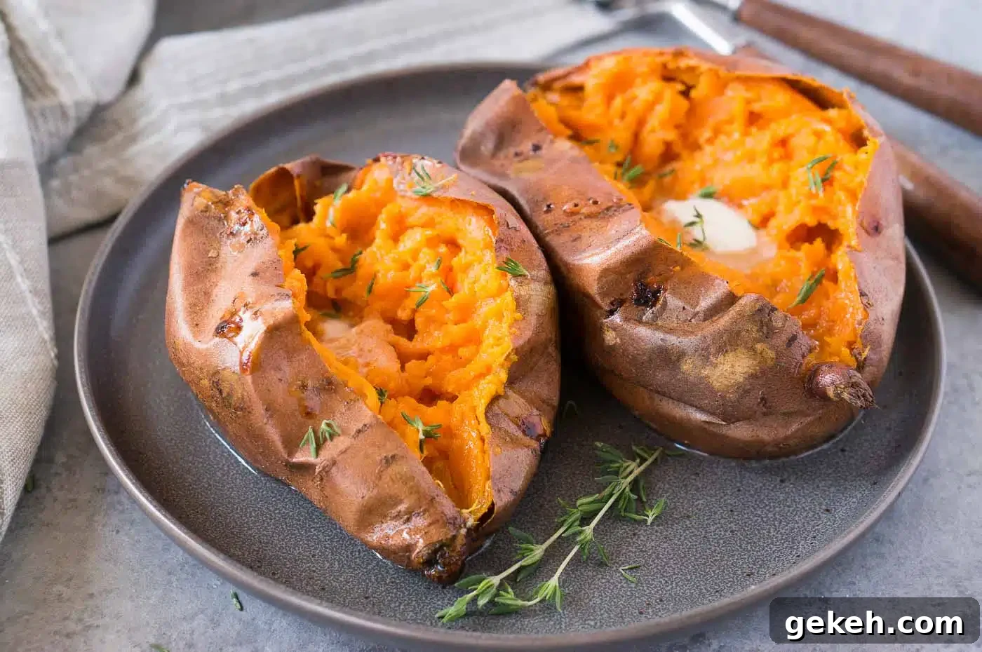 Crispy-Roasted Sweet Potatoes with Garlic and Herbs 3 two sweet potatoes cut open and served with butter