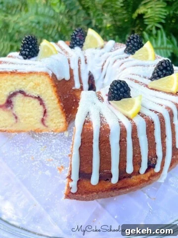 Lemon Blackberry Pound Cake on a cake plate.