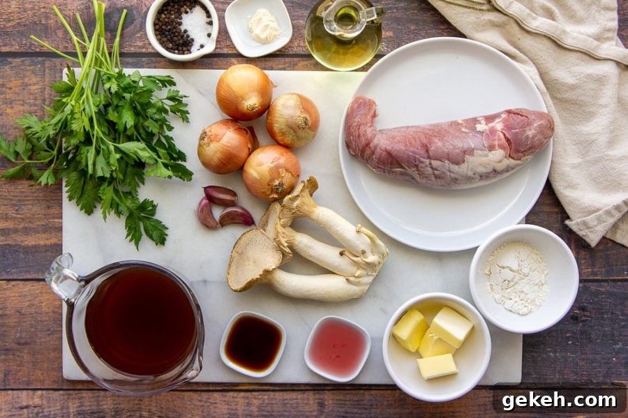 Seared Pork Tenderloin with Creamy Mushroom Sauce 3 ingredients on a white cutting board spread out