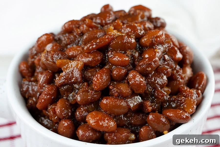 Slow Cooker Boston Baked Beans in a white ramekin.