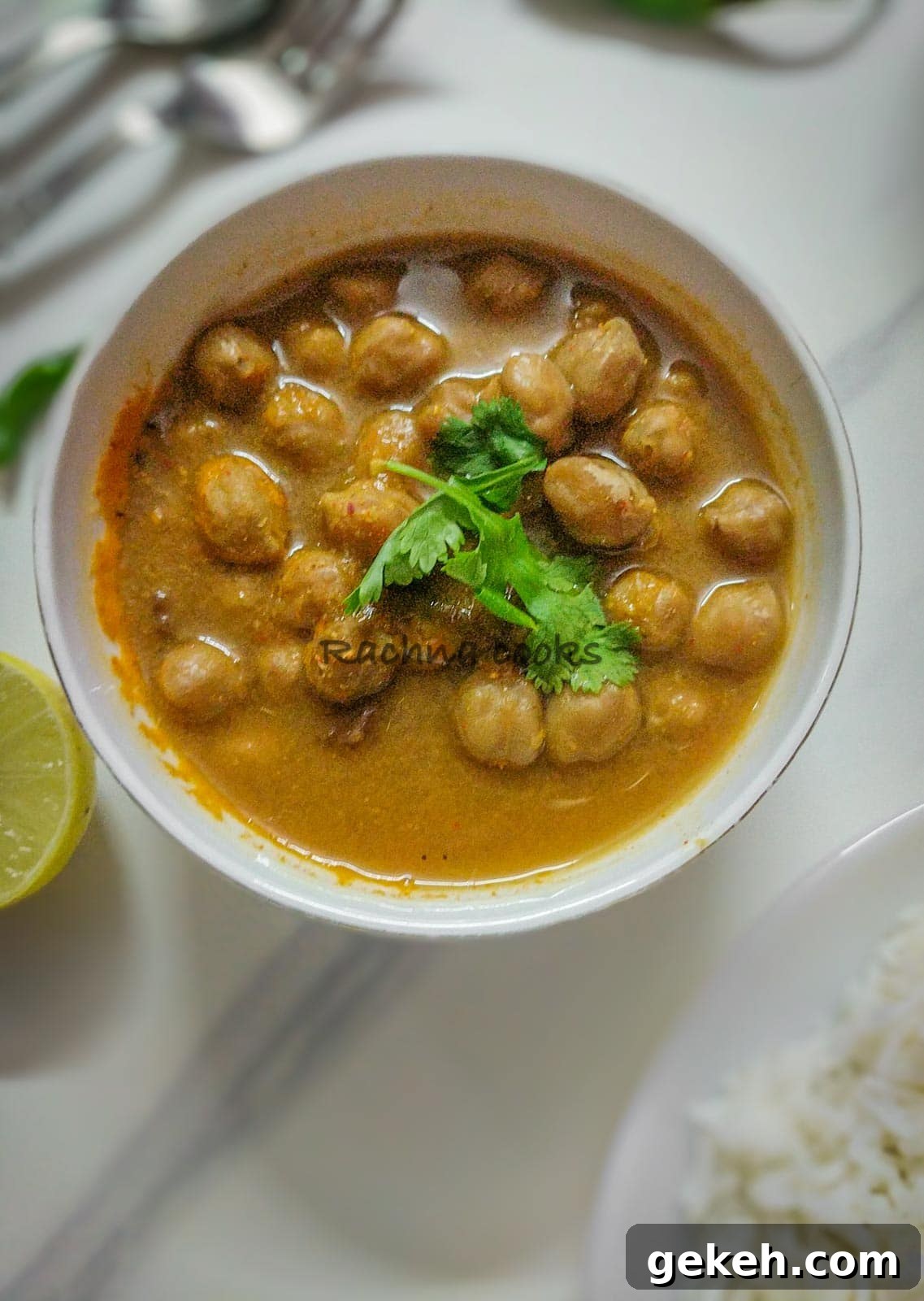 Instant Pot Punjabi Chole (Authentic Chana Masala Recipe) 4 A bowl of chole curry on a white background.