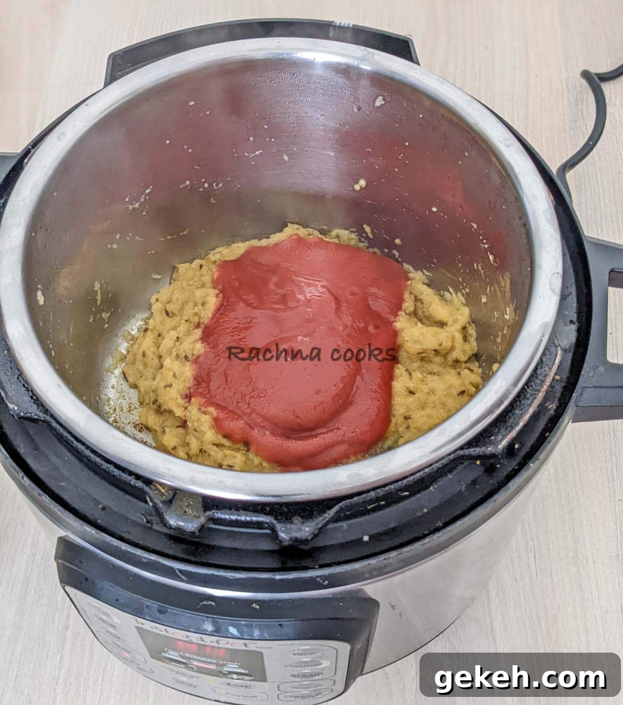 Instant Pot Punjabi Chole (Authentic Chana Masala Recipe) 7 Instant pot with fried paste to which tomato paste is added.