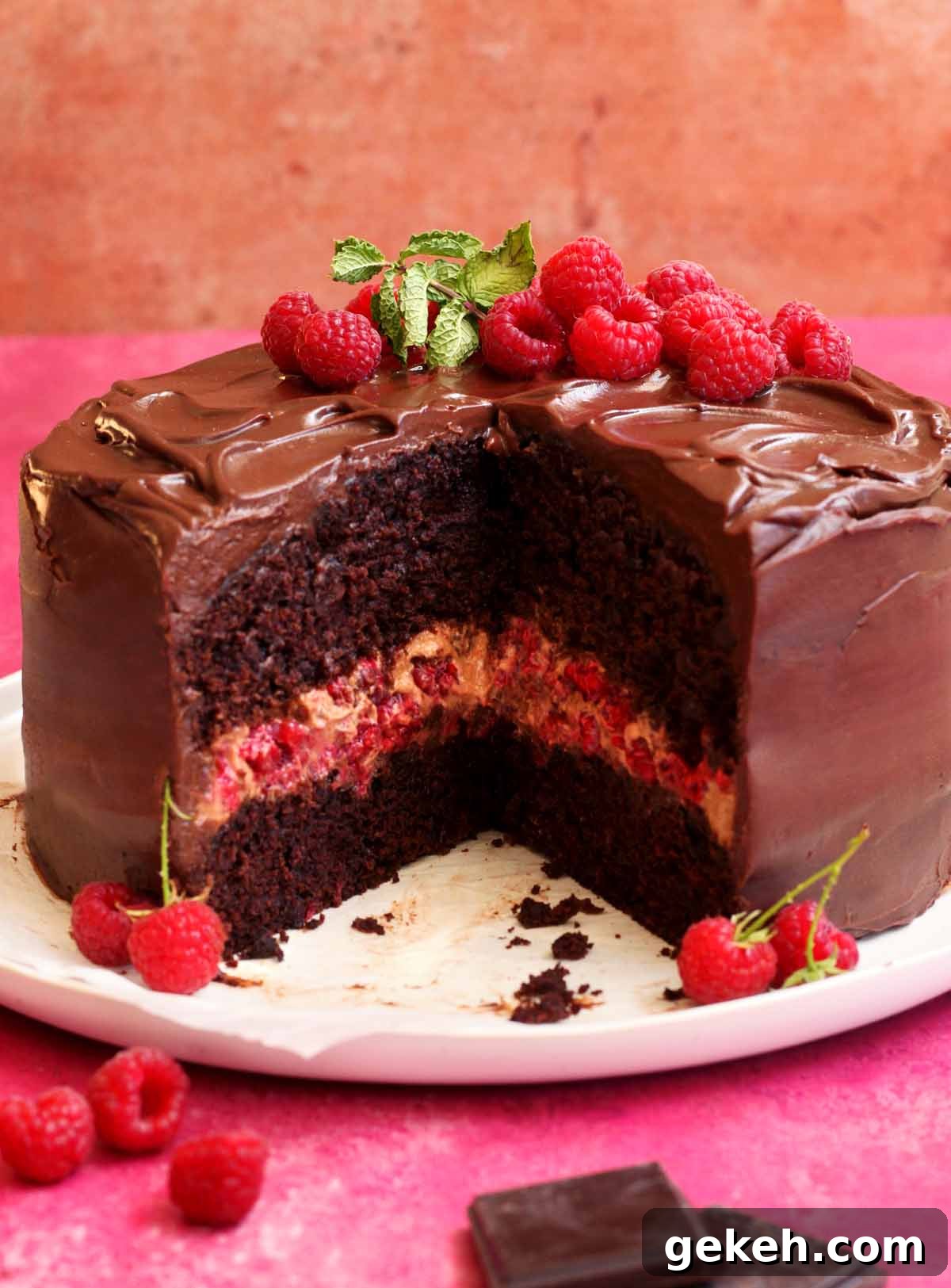 chocolate raspberry cake sliced on serving plate