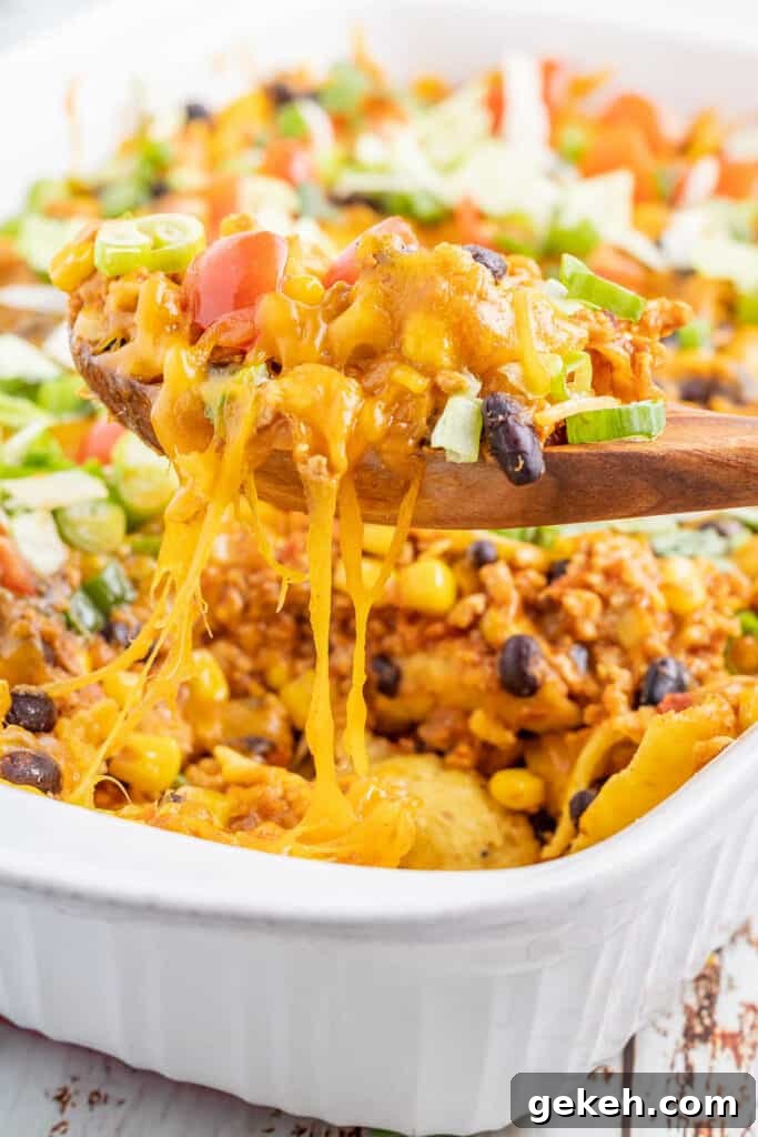 Cheesy Taco Casserole Recipe for Weeknight Dinners 4 wooden spoon with taco casserole