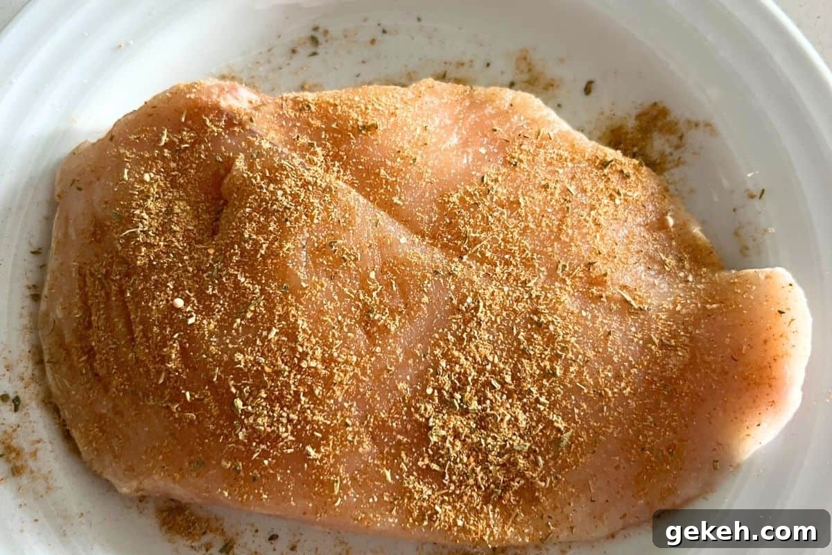 Crispy Air Fryer Chicken Breast Recipe — Juicy in 20 Minutes 4 Seasoned chicken breast with olive oil.