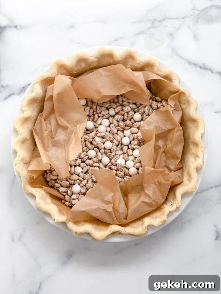 How to Make a Flaky Pie Crust Every Time 19 the perfect flaky pie crust filled with weights