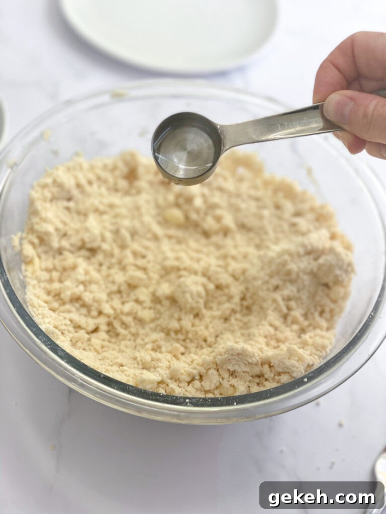 How to Make a Flaky Pie Crust Every Time 9 adding water to dough