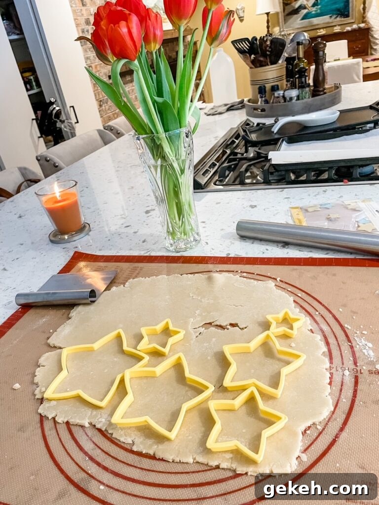 Rolled out dough with the cutters placed to maximize the amount of stars