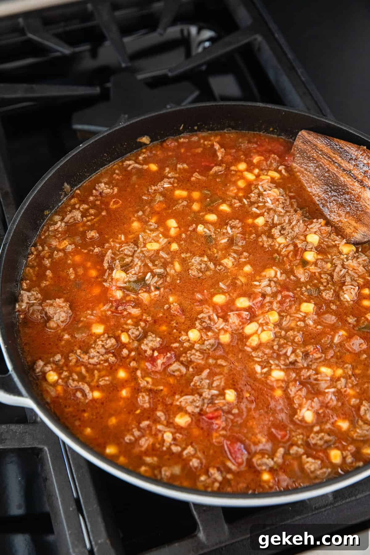 Savory Ground Beef and Salsa Rice Skillet Recipe 5 Adding ingredients to the ground beef.