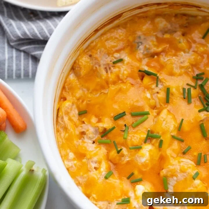 Healthy Buffalo Chicken Dip with raw carrots and celery