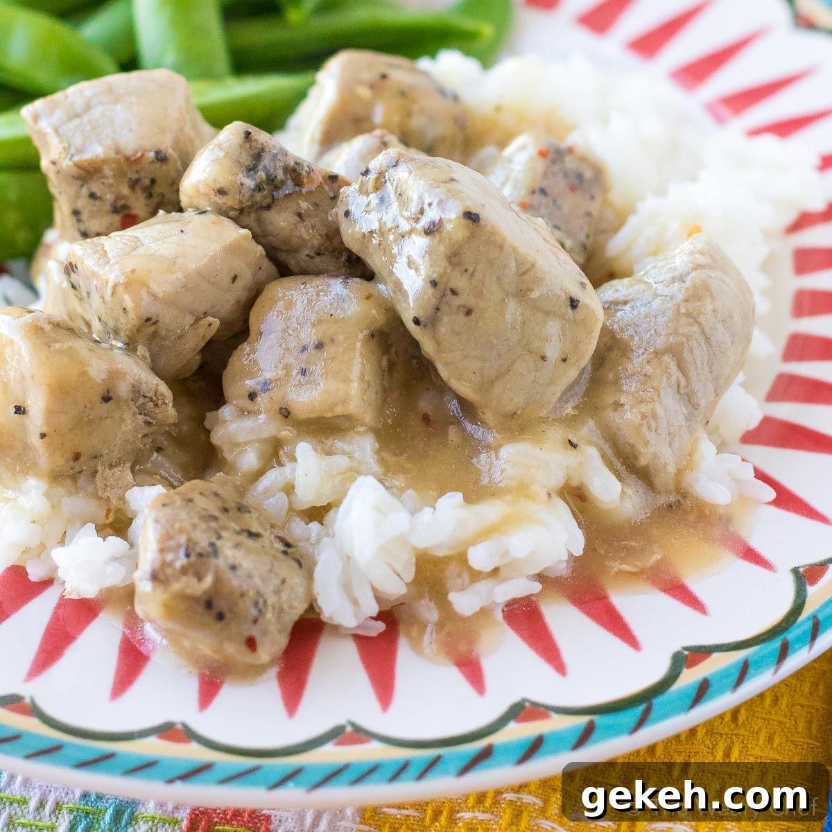 Four-ingredient Pork Tips with Gravy might be my favorite pork recipe ever, and that's saying a lot! This meal is so simple and delicious that you'll want to put it on your menu every week. #pork #gravy #easydinner