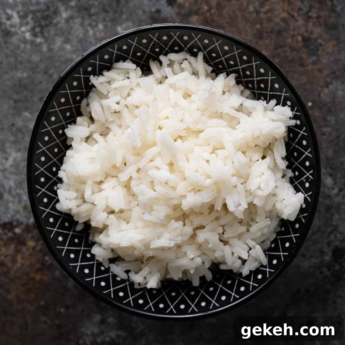 Perfect White Rice Every Time: Simple Stovetop & Rice Cooker Method 2 white rice in a black and white bowl