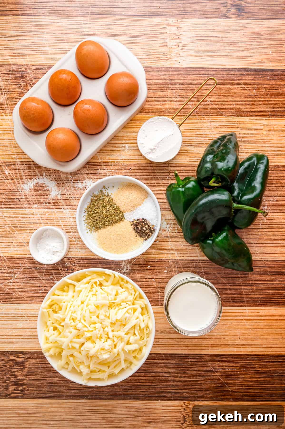 With layers of roasted poblano peppers and gooey cheese topped with fluffy eggs, this Chile Relleno Casserole is easy & flavorful. Overhead view of ingredients needed to make chile relleno casserole