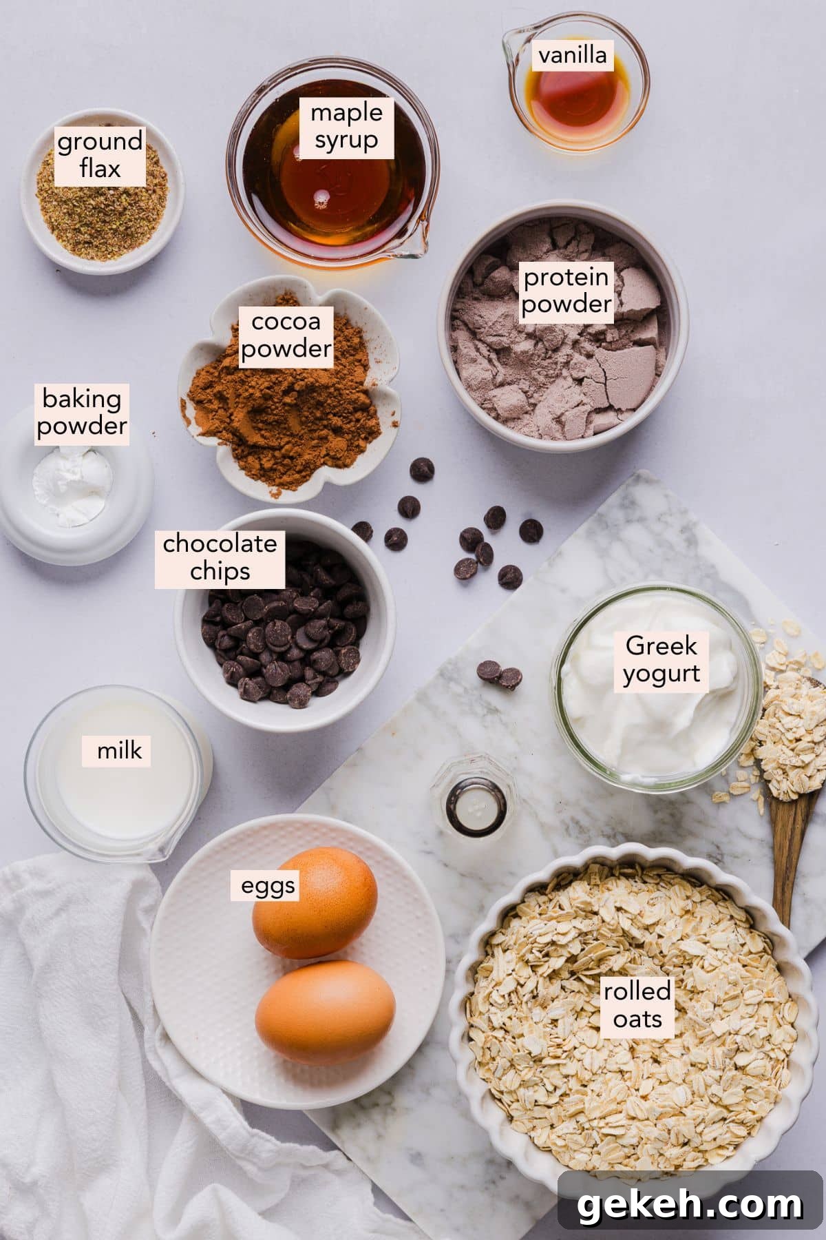 Ingredients for chocolate baked oats on a countertop with labels.