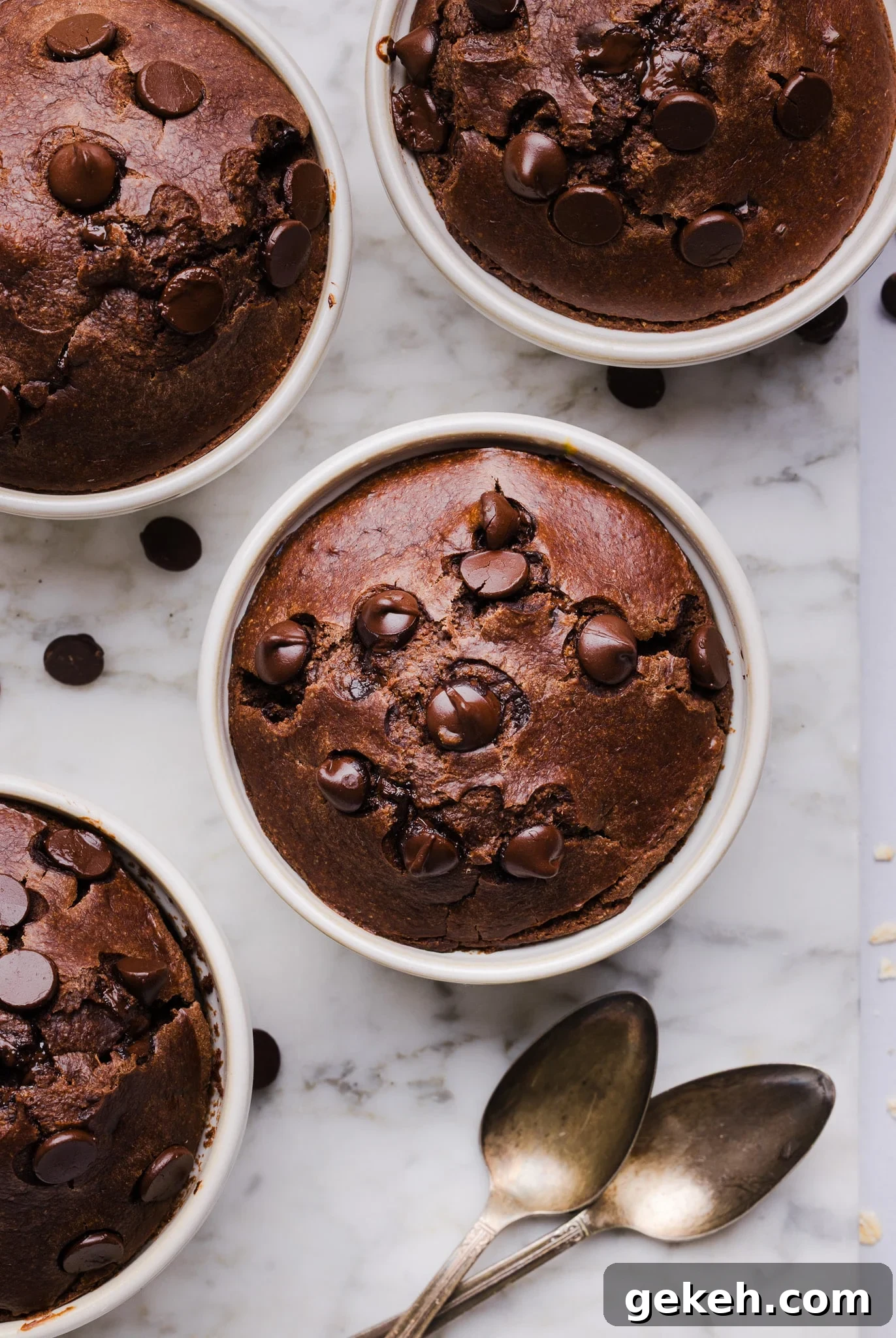 Chocolate baked oats in white ramekins.