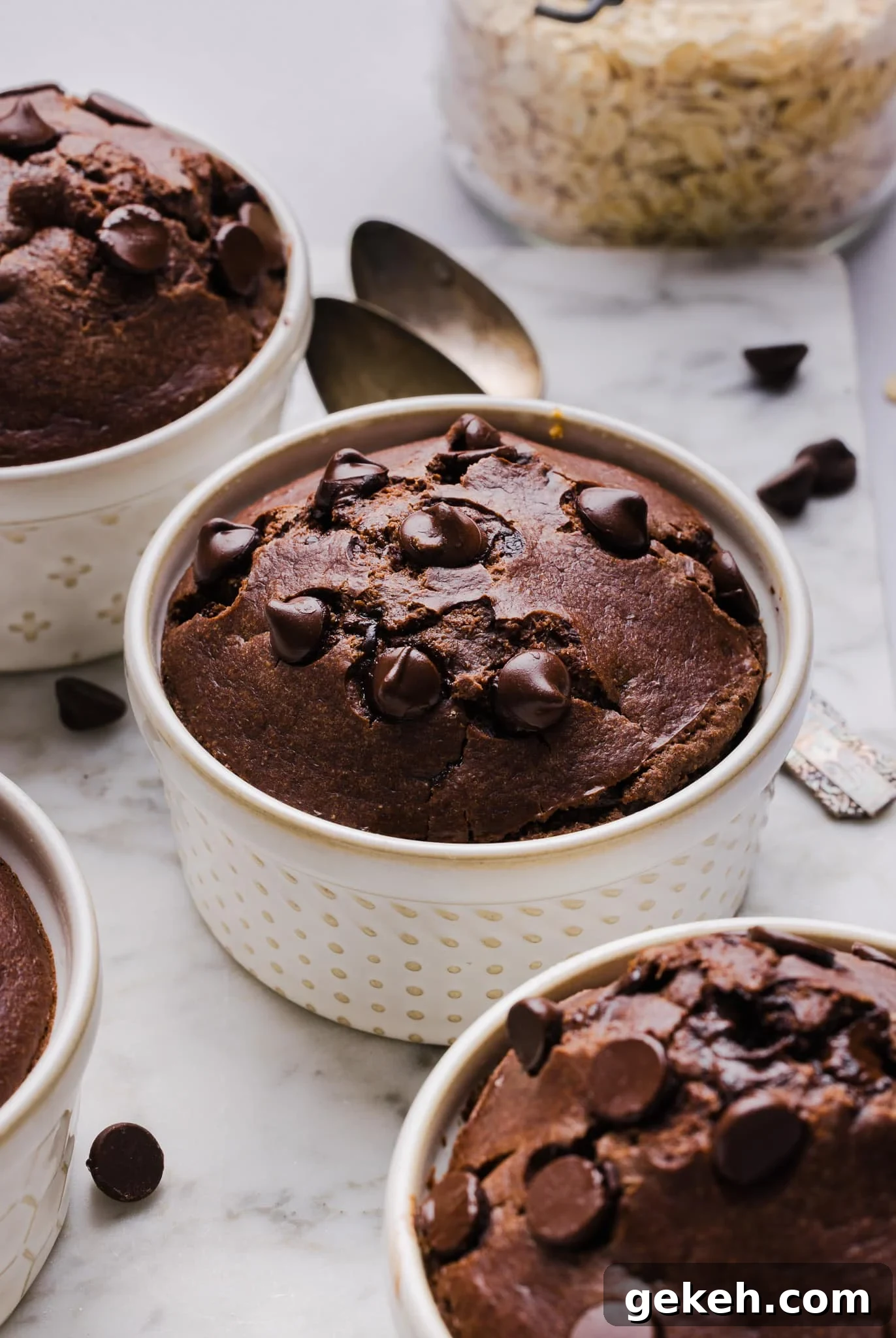 Chocolate baked oats in white ramekins.