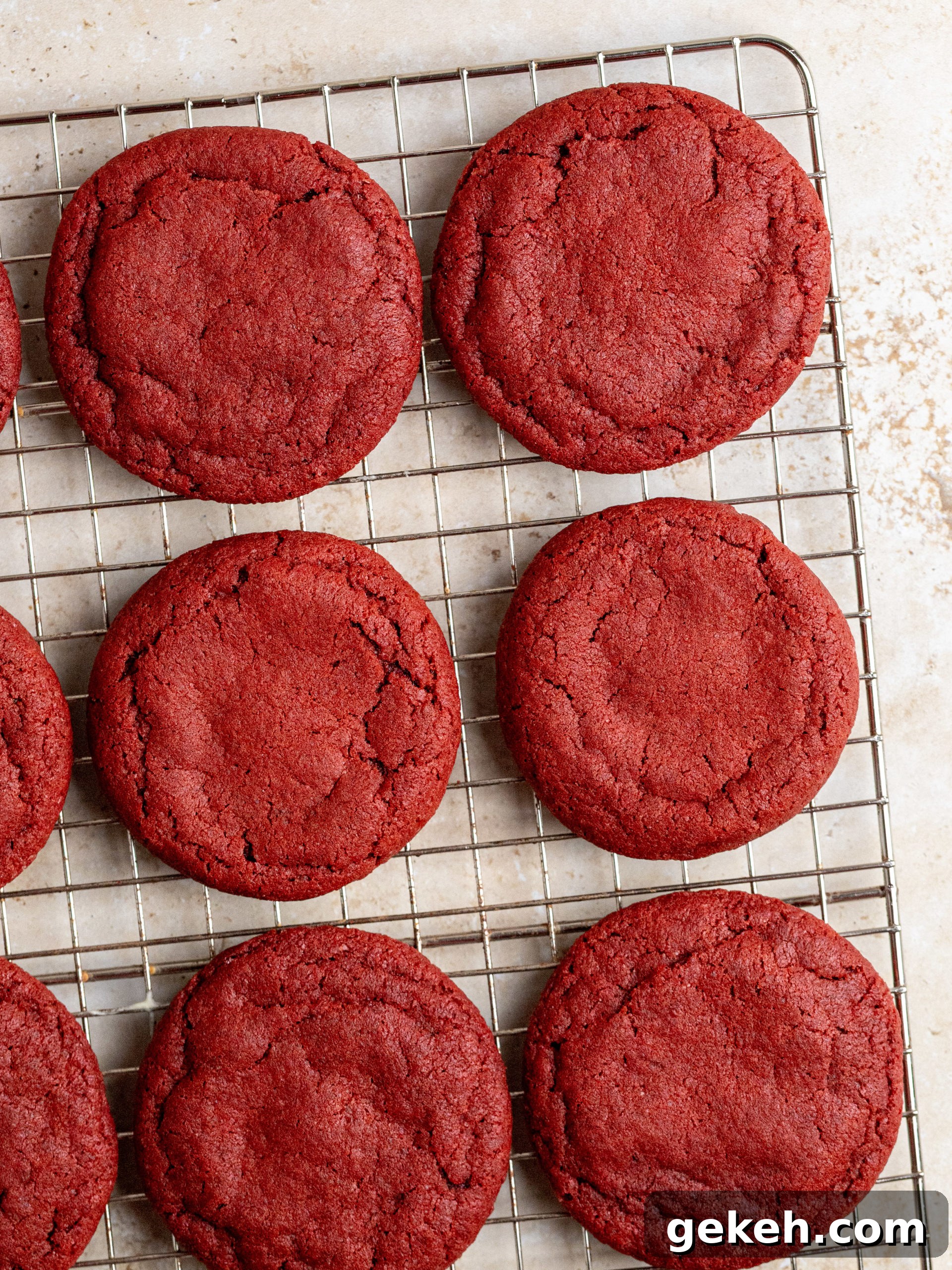 Piping cream cheese frosting onto cookies